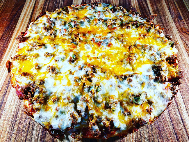 taco pizza out of the over, ready for toppings!