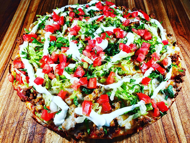Dig in! Taco pizza, the best of both worlds!