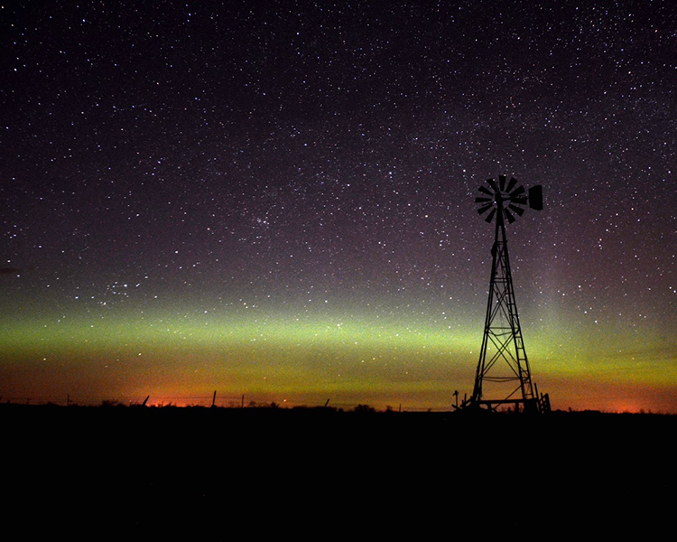 Northern Lights and windmill by Roger Riveland