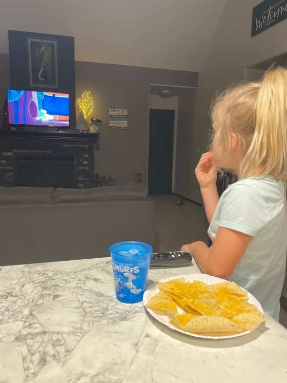 Miss A gets a bedtime snack and cartoons