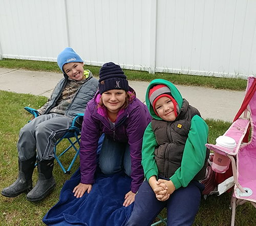 Carie's kids wait for the parade to start