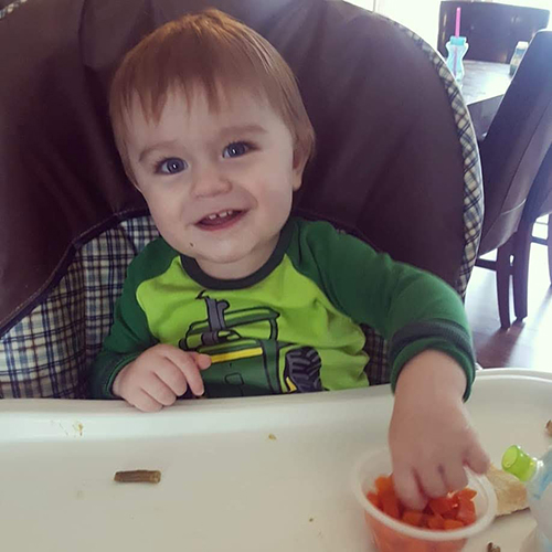 The youngest is a highchair eating champ!