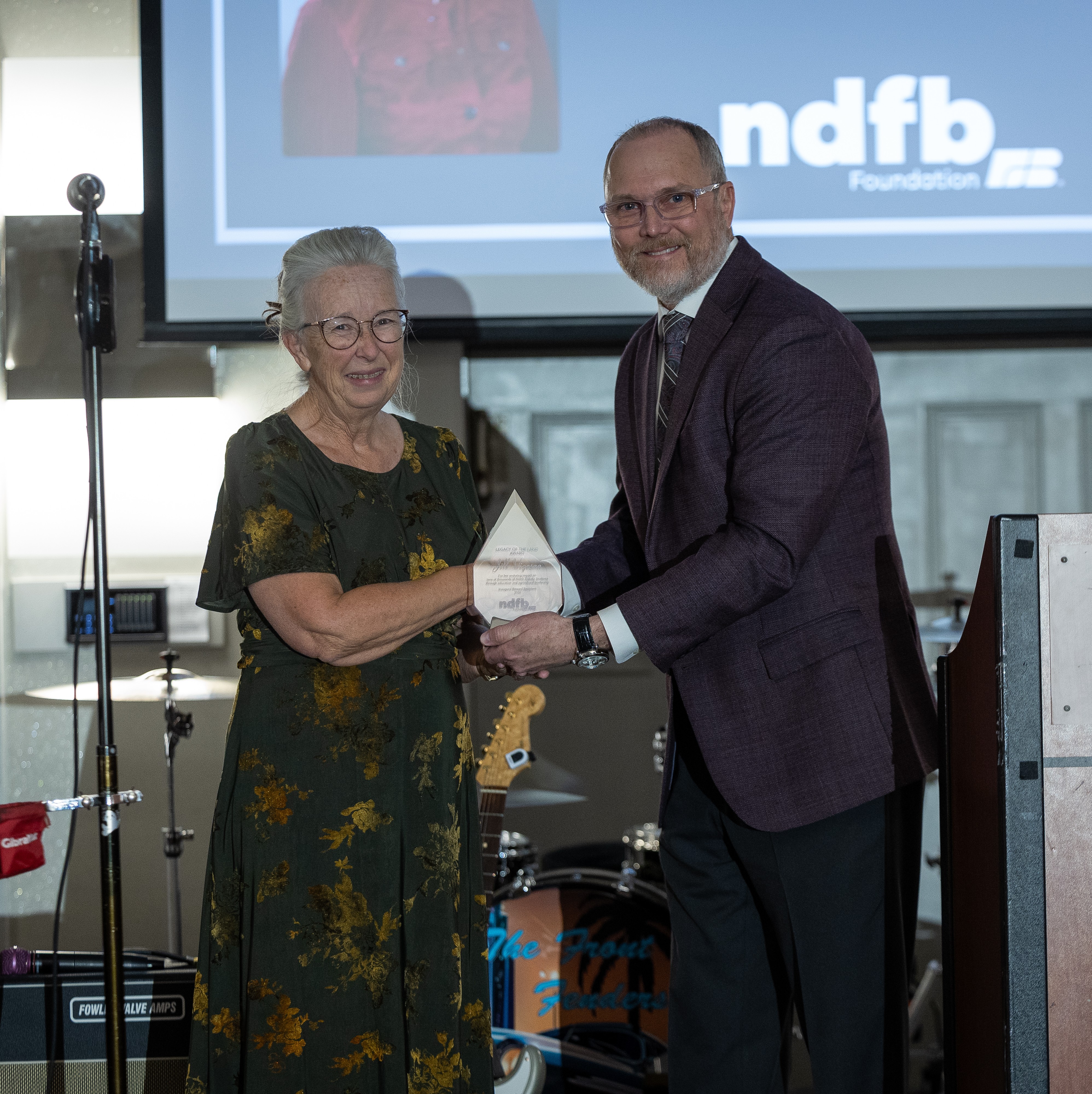 Jill Vigesaa received the inaugural Legacy of the Land award from NDFB Executive Vice President and CEO Jeffrey Missling