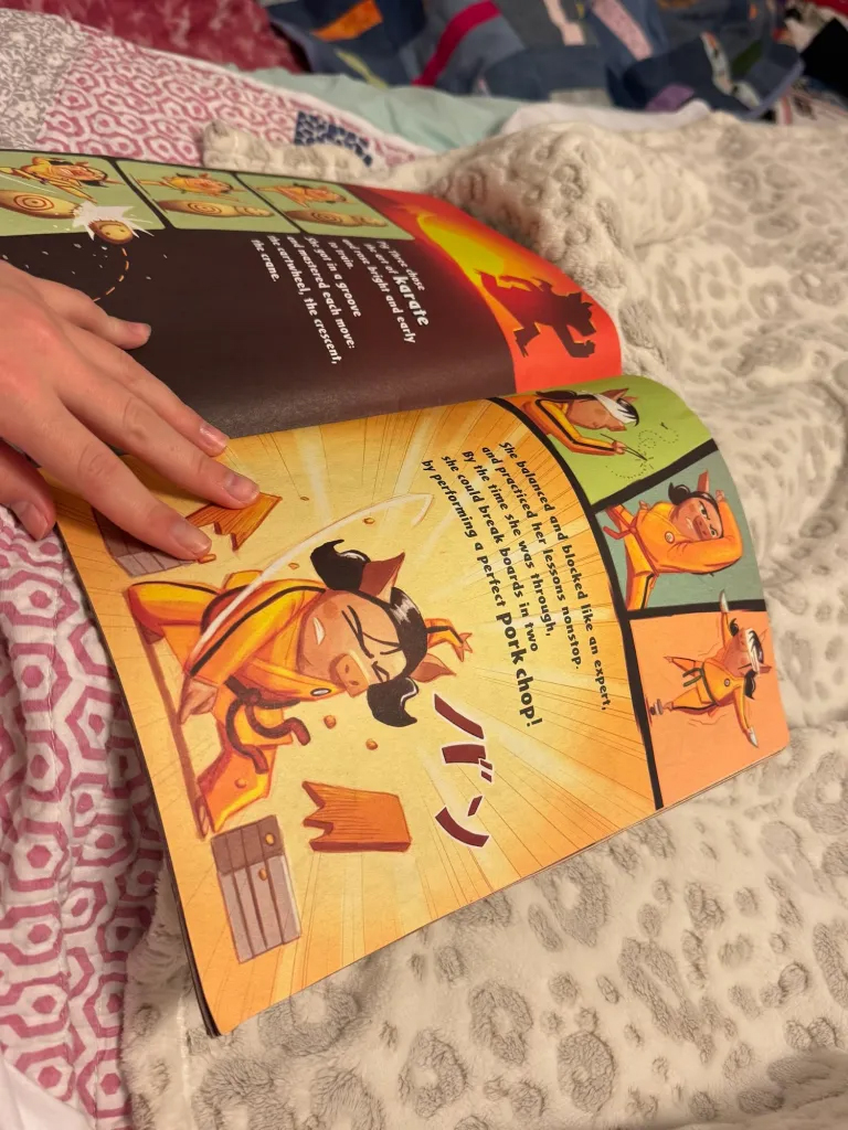 Reading a book about Ninja pigs to daughter