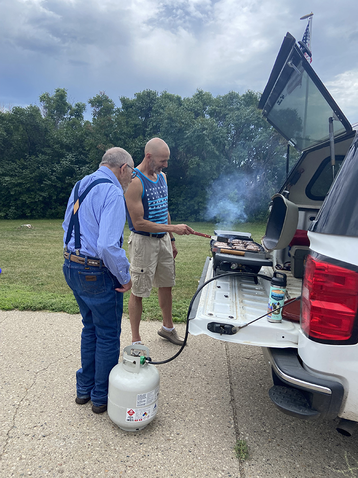 Sam's dad and grandpa on grilling duty