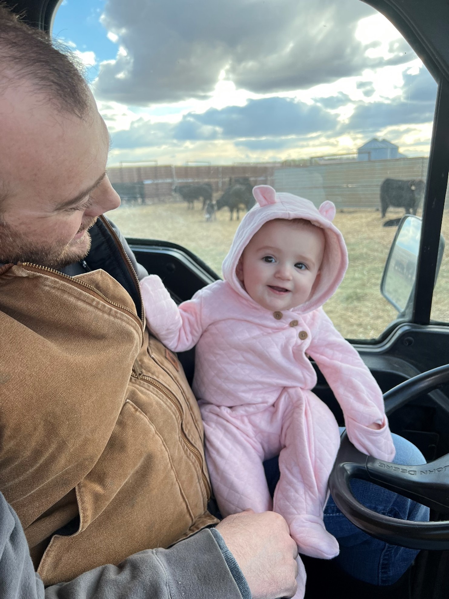 Brad and his daughter check cattle
