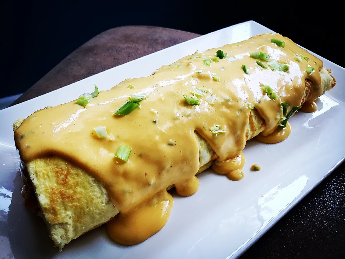 cheese sauce on rolled omelette