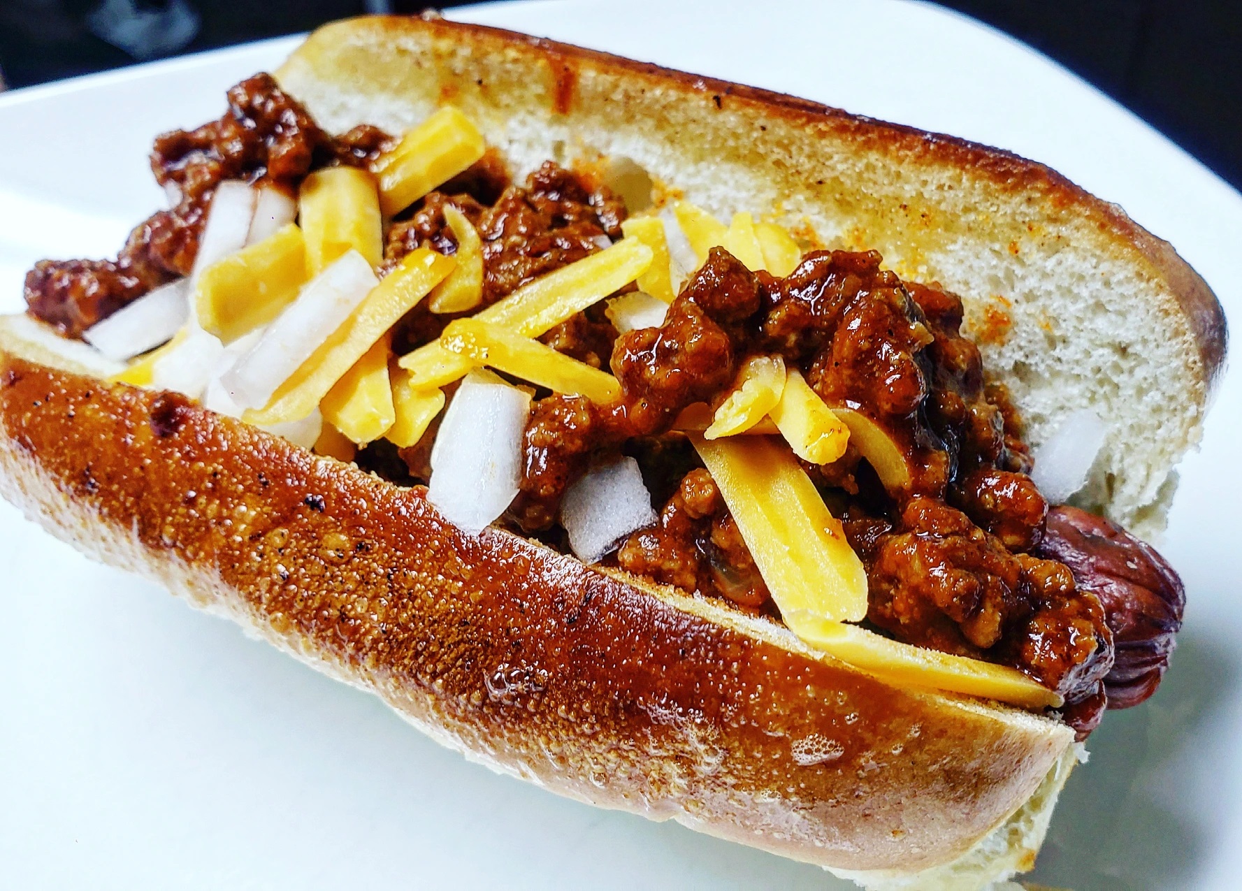 Chili dog with slow cooker beef chili topping