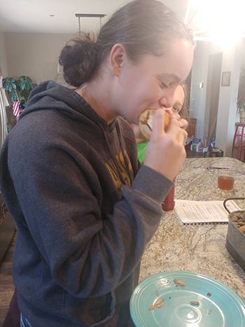 Tate testing the taco pulled pork sandwich